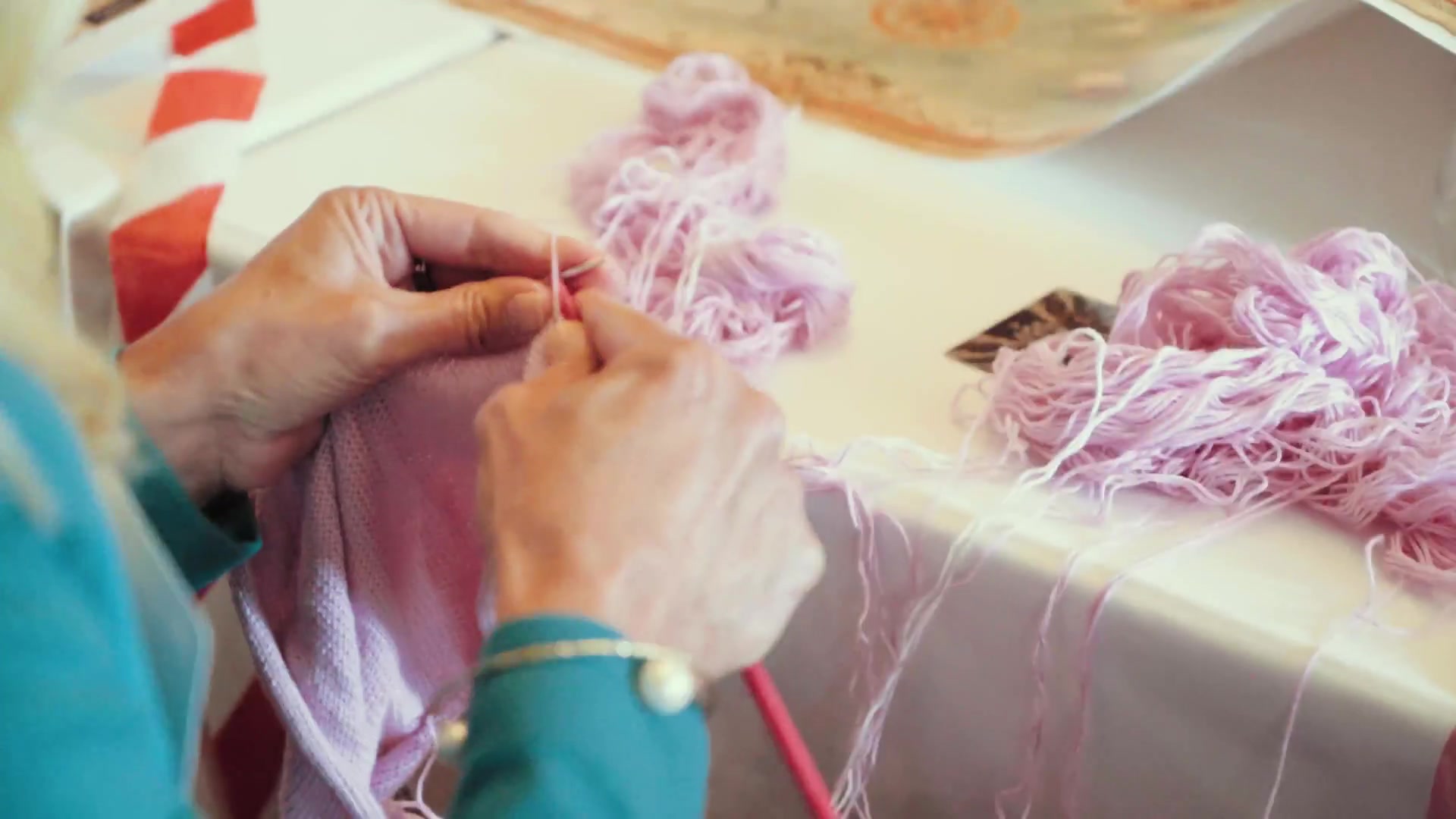 Hands, thread and an unfolding story